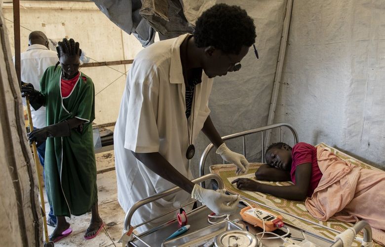 Nyakaka Yomlat is tested for malaria in Old Fangak, South Sudan, in 2021. MUST CREDIT: Photo for The Washington Post by Adrienne Surprenant