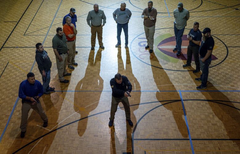 In a photo from Zackary Canepari, an Agape Tactical instructor teaches members of Tulip Grove Baptist Church in Old Hickory, Tenn., Nov. 2019. Rising gun violence is fueling a more than $3 billion industry of companies working to protect children or employees of schools against mass murder. (Zackary Canepari via The New York Times) 