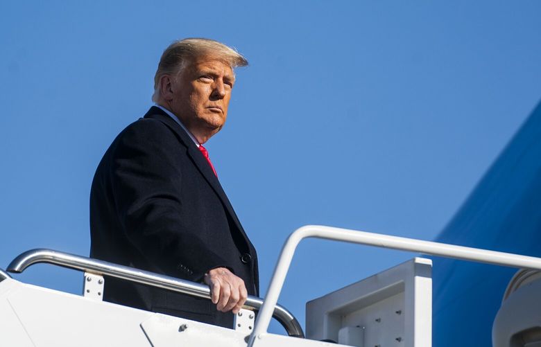 FILE – Then President Donald Trump boards Air Force One at Joint Base Andrews in Maryland, Jan. 12, 2021. On Thursday, Feb. 17, 2023, after a lengthy criminal investigation by a Georgia special grand jury into allegations of election interference by Trump and his allies, a judge released excerpts from a report drafted by the panel. (Doug Mills/The New York Times) XNYT81 XNYT81