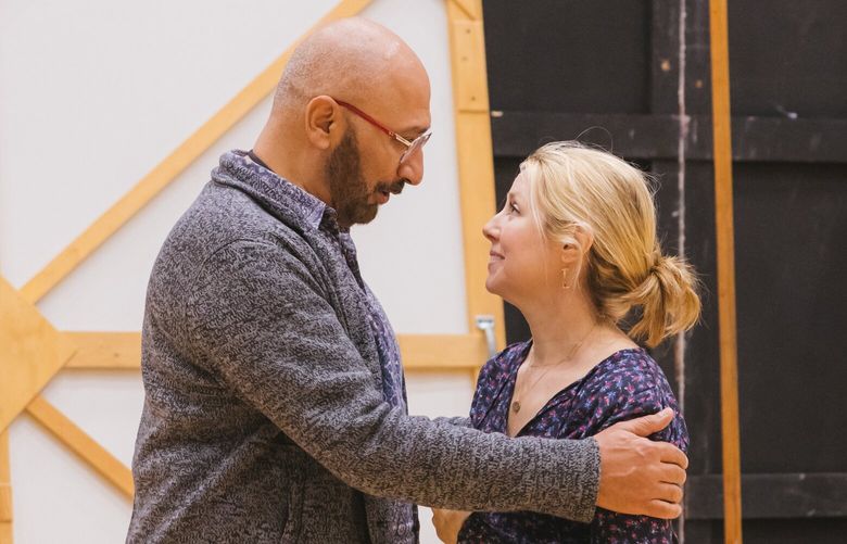 From left: Ashraf Sewailam (Hakim/Driver) and Maureen McKay (Laila) at a rehearsal for A THOUSAND SPLENDID SUNS at Seattle Opera on February 3, 2023.