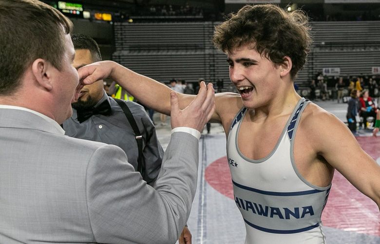 Chiawana’s Daeton Johnson celebrates his 4A 126-pound championship win during the WIAA Mat Classic XXIV Saturday afternoon in Tacoma, Washington on February 18, 2023.