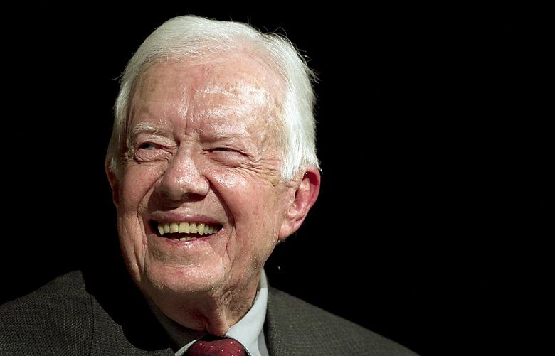 Former U.S. President Jimmy Carter speaks with Mark Updegrove, director of the Lyndon B. Johnson Presidential Library in Austin, on the first day of the Civil Rights Summit, Tuesday, April 8, 2014, in Austin, Texas. (AP Photo/Statesman.com, Ralph Barrera, Pool) TXAUS451