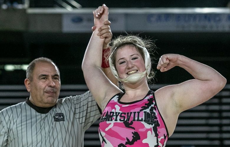 Marysville Pilchuck’s Alivia White celebrates her 190-pound championship win in the WIAA Mat Classic XXIV Saturday afternoon in Tacoma, Washington on February 18, 2023.