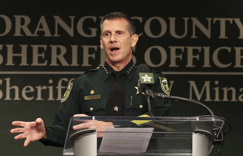 Orange County Sheriff John Mina addresses the media during a press conference about multiple shootings, Wednesday, Feb. 22, 2023, in Orlando, Fla. A central Florida television journalist and a little girl were fatally shot Wednesday afternoon near the scene of a fatal shooting from earlier in the day, authorities said. Mina said that they’ve detained Keith Melvin Moses, 19, who they believe is responsible for both shootings in the Orlando-area neighborhood. (Ricardo Ramirez Buxeda/Orlando Sentinel via AP) FLORL201 FLORL201