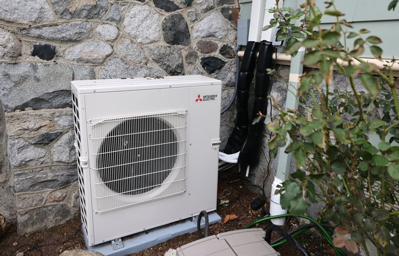 The heat pump and line set outside the house. Michael O’Neill and his wife Katie Raser live in West Seattle in an older home and recently went through a heat pump installation that has not gone totally according to plan, photographed on Friday, February 3, 2023.