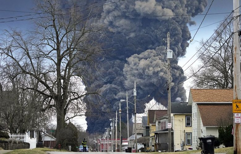 FILE – A plume rises over East Palestine, Ohio, as a result of the controlled detonation of a portion of the derailed Norfolk Southern trains, Feb. 6, 2023. After the catastrophic train car derailment in East Palestine, Ohio, some officials are raising concerns about a type of toxic substance that tends to stay in the environment. (AP Photo/Gene J. Puskar, File) CLI201 CLI201