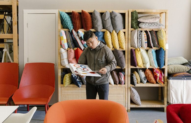Tenzin Norbu, who runs a furniture reselling company called Enliven, at his showroom in Richmond, Calif., Feb. 15, 2023. As tech companies cut costs and move to remote work, their left behind office furniture has become part of a booming trade. (Jason Henry/The New York Times) 