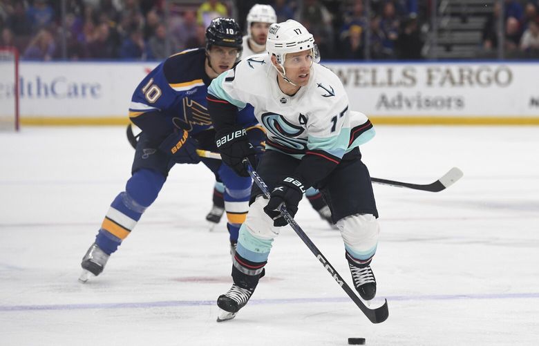 Seattle Kraken’ Jaden Schwartz (17) works the puck against the St. Louis Blues during the first period of an NHL hockey game on Tuesday, Feb. 28, 2023, in St. Louis. (AP Photo/Michael Thomas)