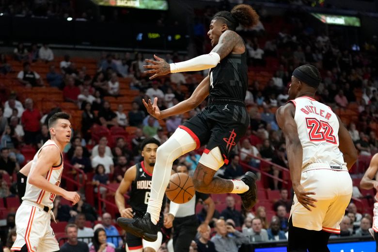 Miami Heat forward Jimmy Butler (22) dunks as Brooklyn Nets guard