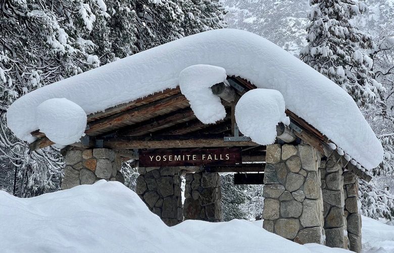 In this photo provided by the National Park Service, a structure at Yosemite Falls in Yosemite National Park, Calif., is covered in snow Tuesday, Feb. 28, 2023. Yosemite National Park, closed since Saturday because of heavy, blinding snow, postponed its planned Thursday, March 2, 2023, reopening indefinitely. (National Park Service via AP) FX307 FX307