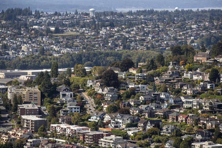Seattle&#8217;s Queen Anne neighborhood with the Magnolia neighborhood in the distance as seen from the Space Needle. (Amanda Snyder / The Seattle Times, 2021)
