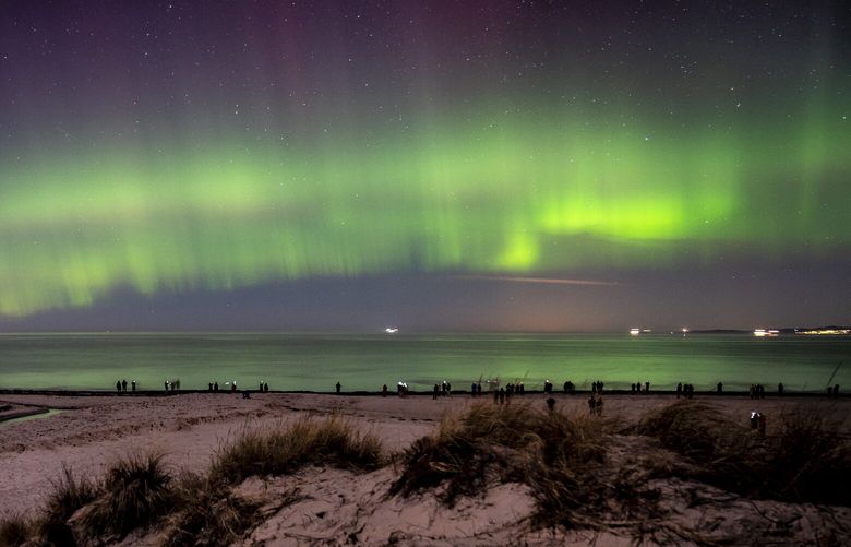 Northern Lights are seen from Hornbaek beach in the northern part of Sealand in Denmark, Monday, Feb, 27, 2023. (Mads Claus Rasmussen/Ritzau Scanpix via AP) LBL803 LBL803