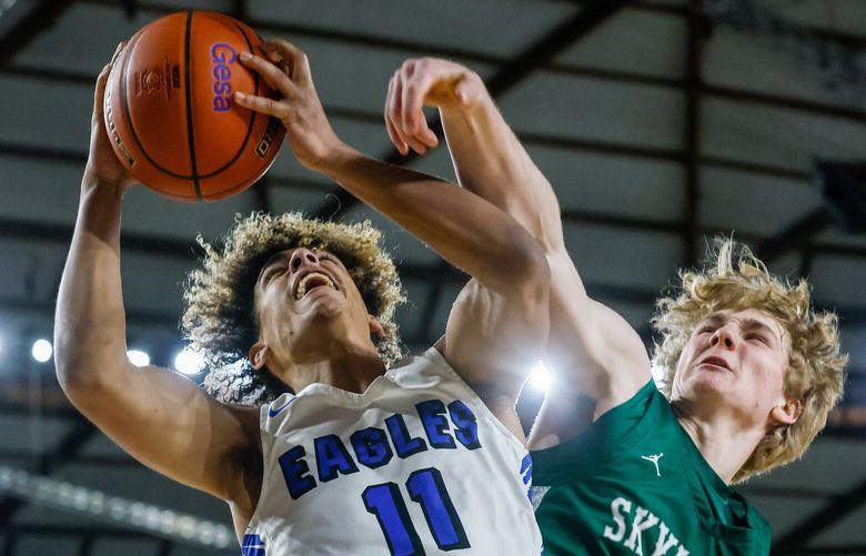 Federal Way’s Isaiah Afework is fouled and the basket by Skyline’s Atticus Boba Thursday morning in a 4A boys quarterfinals games during the 2023 Hardwood Classic in Tacoma, Washington on March 2, 2023. Federal Way won 69-53 to advance.