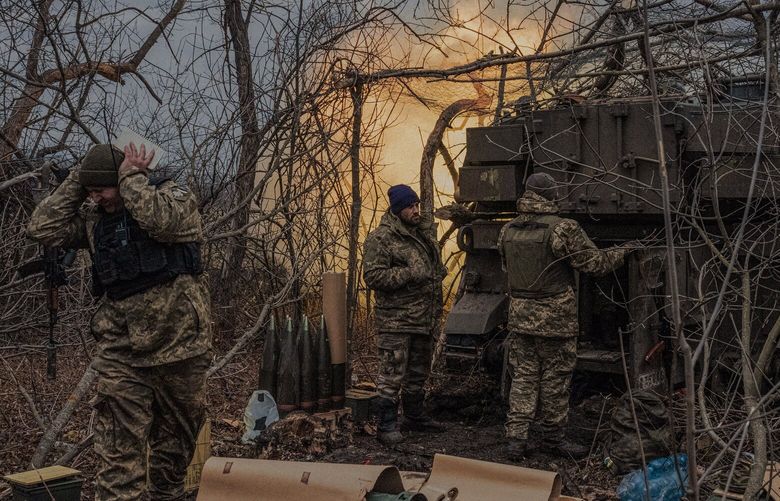 **EMBARGO: No electronic distribution, Web posting or street sales before MONDAY 3:01 A.M. ET MARCH 6, 2023. No exceptions for any reasons. EMBARGO set by source.** Ukrainian soldiers fire artillery rounds toward a Russian infantry position near Bakhmut, Ukraine, March 3, 2023. Ukrainian commanders acknowledged that their forces in Bakhmut still faced the risk of encirclement, but the fighting over the weekend showed that a military that has surprised the world with its doggedness was not yet ready to give up on Bakhmut. (Daniel Berehulak/The New York Times) XNYT129 XNYT129