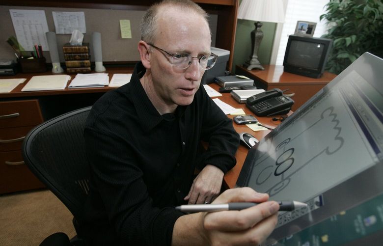 FILE – Scott Adams, creator of Dilbert, works on his comic strip in his studio in in Dublin, Calif., on Oct. 26, 2006. Syndication company Andrews McMeel announced they were severing ties with Adams after he made comments about race on his YouTube show, “Real Coffee with Scott Adams.” (AP Photo/Marcio Jose Sanchez, File) NYET105 NYET105