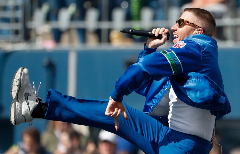 Lumen Field – Tennessee Titans at Seattle Seahawks – 091921

Macklemore performs before the start of a game against the Tennessee Titans Sept. 19, 2021, in Seattle. 218243