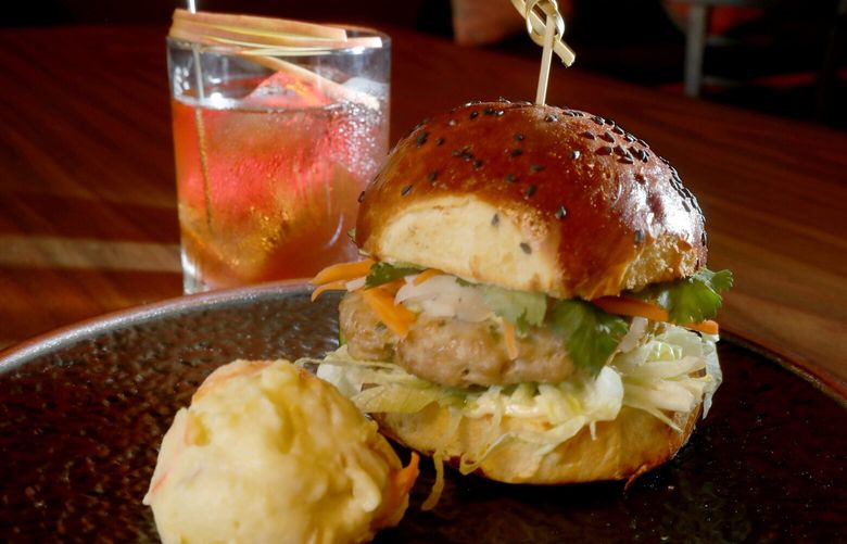 Amy Beaumier is the chef and co owner of the hot hip bar The Dark Room in Greenwood..   On the menu is her pork and shrimp sandwich.  The drink is the â€œTeacherâ€™s Petâ€.