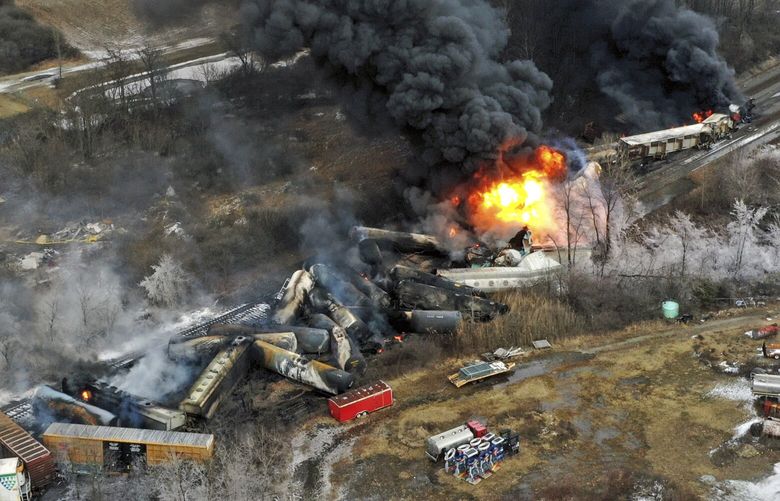 A drone image shows portions of a Norfolk Southern freight train that derailed on Feb 3 in East Palestine, Ohio, still on fire at mid-day Feb. 4, 2023. (Gene J. Puskar / The Associated Press)
