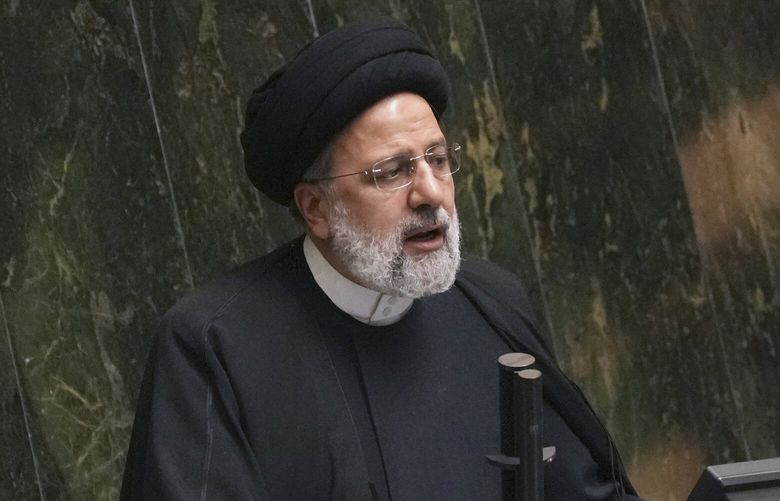 FILE – Iranian President Ebrahim Raisi addresses lawmakers while defending his next year’s budget bill at the parliament in Tehran, Iran, Sunday, Jan. 22, 2023. Raisi on Wednesday, March 1, ordered authorities to investigate a series of incidents in which noxious fumes have sickened students at girls’ schools, which some officials suspect are attacks targeting women’s education.(AP Photo/Vahid Salemi, File) CAIDK301 CAIDK301