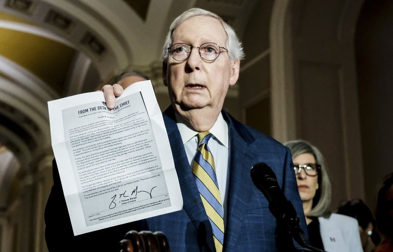 Sen. Mitch McConnell (R-Ky.) holds a copy of a letter from U.S. Capitol Police Chief Tom Manger responding to Tucker Carlson’s use of January 6 footage during a news conference on Capitol Hill in Washington, March 7, 2023. McConnell said, “It was a mistake, in my view, for Fox News to depict this in a way that’s completely at variance with what our chief law enforcement official here at the Capitol thinks.” (Michael A. McCoy/The New York Times) XNYT214 XNYT214