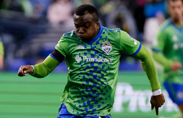 Seattle Sounders FC defender Nouhou dribbles down the field during the first half. 223142