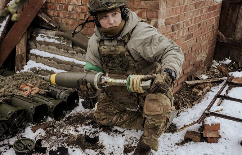 A Ukrainian soldier prepares a mortar near Bakhmut, Ukraine on Tuesday, March 7, 2023. Ukrainian officials said on Tuesday that the Wagner group had shifted to using more professional soldiers in the battle for Bakhmut as its supply of prisoner recruits dwindled, suggesting that Ukraine may be hoping its battle in the city can severely damage a highly effective fighting force for Russia. (Daniel Berehulak/The New York Times) XNYT9 XNYT9