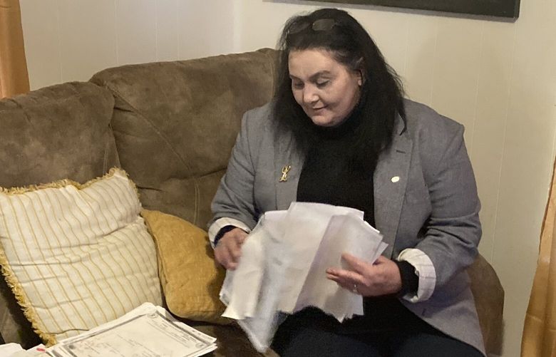 Lisa Spradlin sorts through documents she’s gathered about her son Blake, who is incarcerated in the West Virginia correctional system. Her attempts to find out more about his safety were denied after lawmakers passed a bill to block many jail and prison documents from public scrutiny.