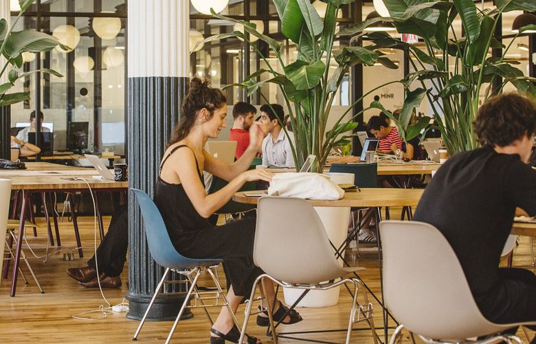 Members of WeWork, a co-working company, at the headquarters in New York, Sept. 2, 2015. (Cole Wilson/The New York Times)