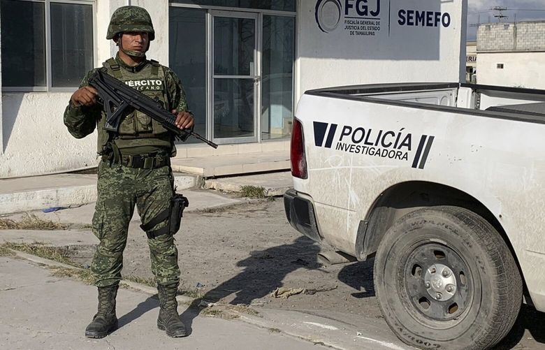 A Mexican army soldier guards the Tamaulipas State Prosecutor’s headquarters in Matamoros, Mexico, Wednesday, March 8, 2023. A road trip to Mexico for cosmetic surgery veered violently off course when four Americans were caught in a drug cartel shootout, leaving two dead and two held captive for days in a remote region of the Gulf coast before they were rescued from a wood shack, officials said Tuesday. (AP Photo) XFLL206 XFLL206