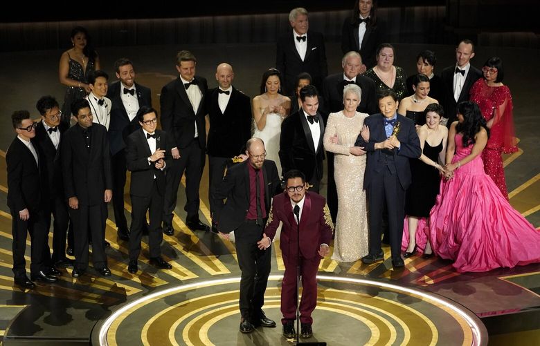 The cast and crew of “Everything Everywhere All at Once” accepts the award for best picture at the Oscars on Sunday, March 12, 2023, at the Dolby Theatre in Los Angeles. (AP Photo/Chris Pizzello) CADA965 CADA965