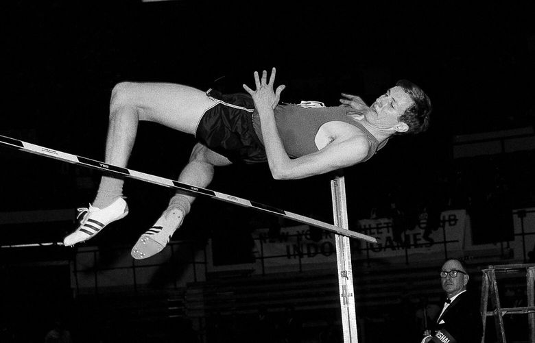 Dick Fosbury of Oregon State tries a seven foot two inch high jump with his head first style in the New York Athletic club track meet at Madison Square Garden in New York, Feb. 17, 1968. Fosbury, the lanky leaper who completely revamped the technical discipline of high jump and won an Olympic gold medal with his “Fosbury Flop,” has died after a recurrence with lymphoma. Fosbury died Sunday, March 12, 2023, according to his publicist, Ray Schulte. He was 76. (AP Photo/FIle)