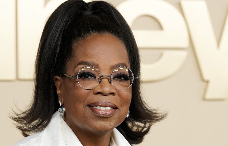 FILE – Oprah Winfrey, a producer of the documentary “Sidney,” about actor Sidney Poitier, appears at the premiere on Sept. 21, 2022 in Los Angeles. Winfrey announced that she had chosen Ann Napolitano’s book “Hello Beautiful” for her 100th book club pick. (AP Photo/Chris Pizzello, File) NYET153 NYET153