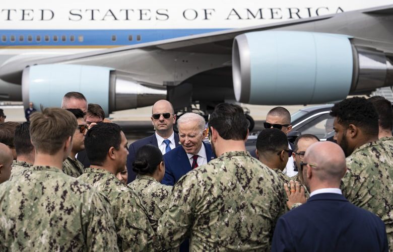 President Joe Biden greets members of the military and their families before he boards Air Force One at North Island Naval Air Station in San Diego, March 14, 2023. President Biden will announce a handful of minor steps designed to improve enforcement of existing gun laws during a trip to Monterey Park, Calif., the site of a mass shooting in January. (Haiyun Jiang/The New York Times) XNYTF XNYTF