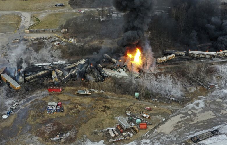 This photo taken with a drone shows portions of a Norfolk and Southern freight train that derailed Friday night in East Palestine, Ohio are still on fire at mid-day Saturday, Feb. 4, 2023. (AP Photo/Gene J. Puskar) OHGP108 OHGP108