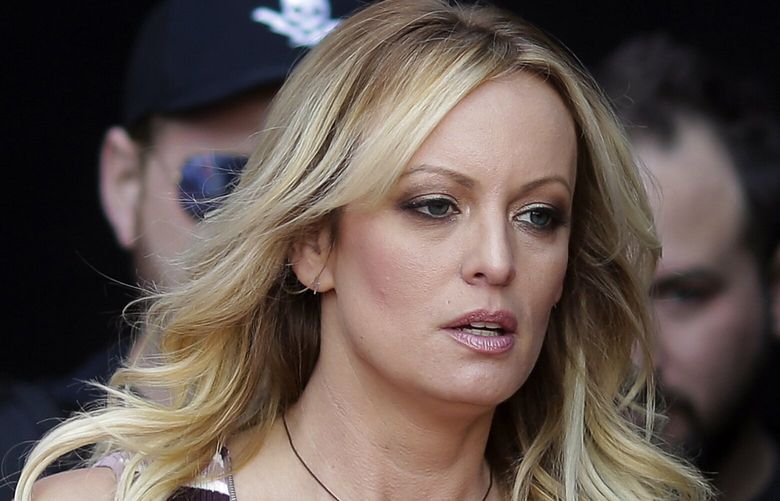 FILE – Adult film actress Stormy Daniels arrives for the opening of the adult entertainment fair Venus in Berlin, on Oct. 11, 2018. Daniels’ lawyer said she met Wednesday, March 15, 2023, with prosecutors who are investigating hush money paid to her on behalf of former President Donald Trump.(AP Photo/Markus Schreiber, File) WX110 WX110