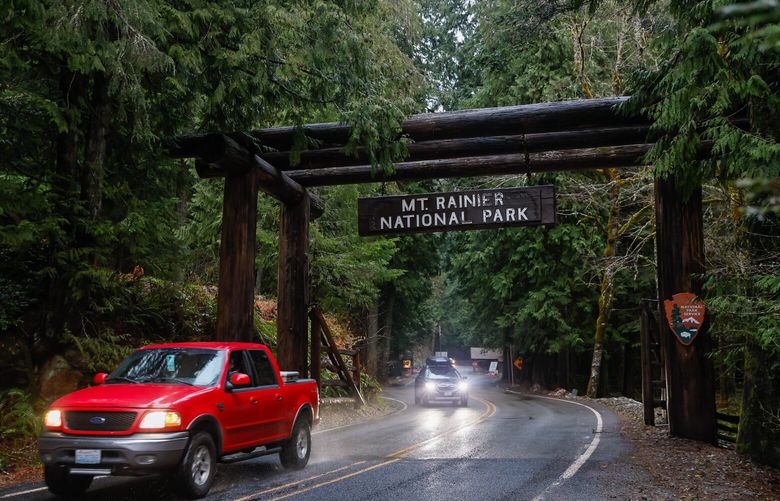 A giant wooden sign welcomes visitors to Mt. Rainier National Park at the Nisqually Entrance, Saturday, Dec. 31, 2022.  222577
