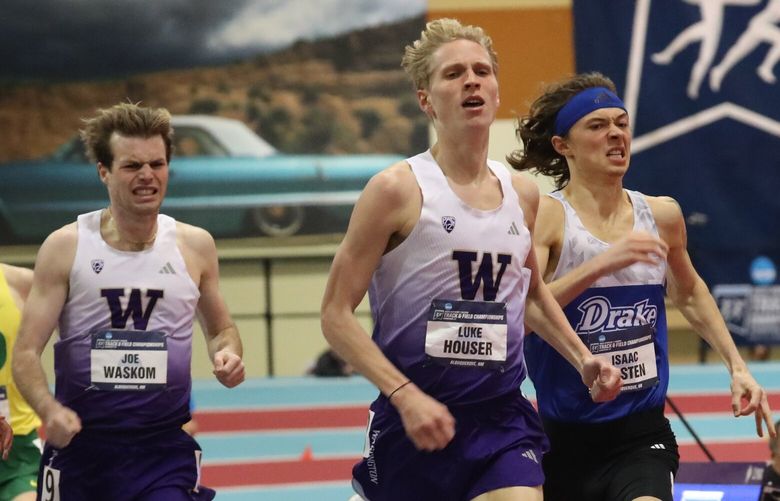 UW’s Luke Houser (center) edges teammate Joe Waskom (left) and Drake’s Isaac Basten (right) for the NCAA Indoor title in the mile on Saturday in Albuquerque, NM.