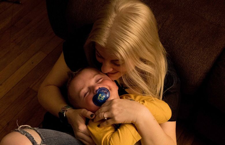 **EMBARGO: No electronic distribution, Web posting or street sales before 12:01 a.m. ET Thursday, March 16, 2023. No exceptions for any reasons. EMBARGO set by source.** Tammy Cunningham and her son, Calum, who was born prematurely, at their home in Kokomo, Ind. on Friday, March 10, 2023. Doctors warned the Cunninghams that he might experience developmental delays, but so far he has not. In 2021, deaths of pregnant women soared by 40 percent in the United States, according to new government figures. (Kaiti Sullivan for New York Times) XNYT160 XNYT160