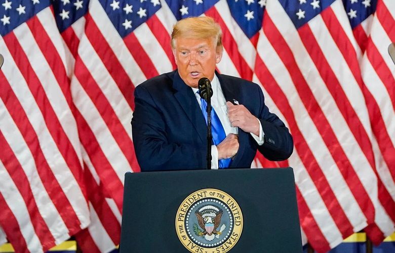 President Donald Trump, with first lady Melania Trump and Vice President Mike Pence, speaks during an election-night event at the White House on Nov. 4, 2020. MUST CREDIT: Washington Post photo by