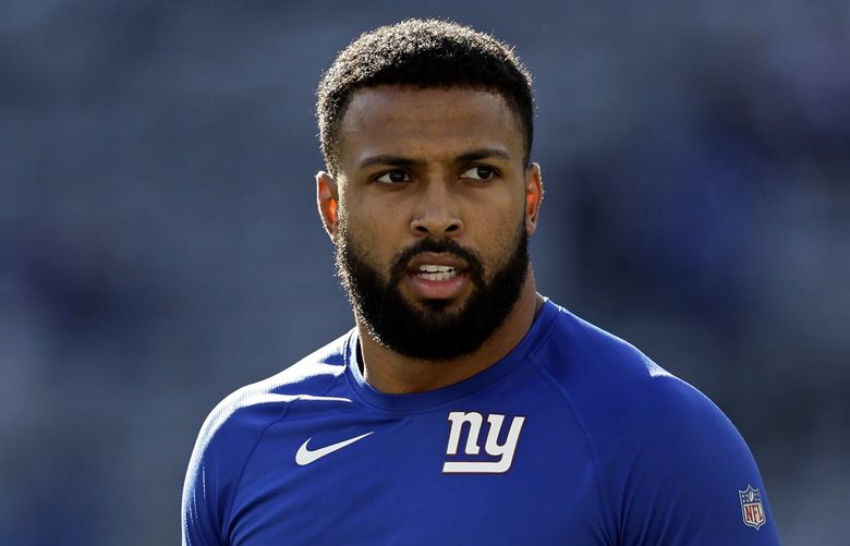 New York Giants safety Julian Love (20) warms up before an NFL football game against the Indianapolis Colts on Sunday, Jan. 1, 2023, in East Rutherford, N.J. (AP Photo/Adam Hunger)