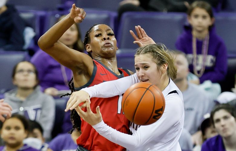 Washington Huskies guard Hannah Stines steals the ball away from New Mexico forward Shaiquel McGruder during the second quarter. 223332