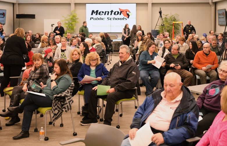 A packed regular monthly school board meeting in Mentor, Ohio, on March 14. MUST CREDIT: Photo for The Washington Post by Dustin Franz