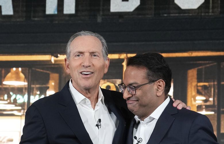 Interim CEO Howard Schultz, left, and incoming CEO Laxman Narasimhan hug during Starbucks Investor Day 2022, Tuesday, Sept. 13, 2022, in Seattle. (AP Photo/Stephen Brashear) WASB104