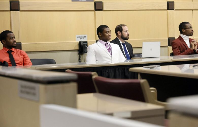 Suspected shooting accomplice Dedrick Williams, left, and Trayvon Newsome are shown seated at the defense table with shooting suspect Michael Boatwright, right, during the fourth day of jury deliberations in the XXXTentacion murder trial at the Broward County Courthouse in Fort Lauderdale, Fla., Monday, March 13, 2023. Emerging rapper XXXTentacion, born Jahseh Onfroy, 20, was killed during a robbery outside of Riva Motorsports in Pompano Beach in 2018, allegedly by defendants Boatwright,  Newsome, and Williams.  (Amy Beth Bennett/South Florida Sun-Sentinel via AP, Pool) FLLAU219 FLLAU219