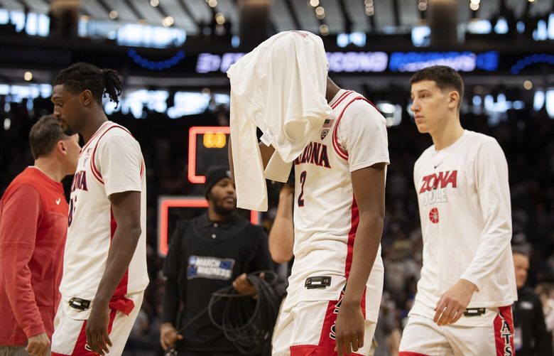 Arizona guard Adama Bal (2) leaves the floor with teammates following a first-round college basketball game loss to Princeton in the NCAA Tournament in Sacramento, Calif., Thursday, March 16, 2023. Princeton won 59-55. (AP Photo/José Luis Villegas) CAJV130 CAJV130