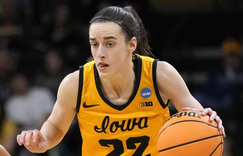 Iowa guard Caitlin Clark (22) drives up court past Southeastern Louisiana guard Cierria Cunningham (2) in the second half of a first-round college basketball game in the NCAA Tournament, Friday, March 17, 2023, in Iowa City, Iowa. Iowa won 95-43. (AP Photo/Charlie Neibergall) IACN140 IACN140