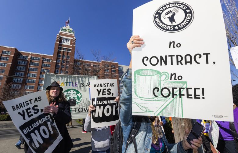 Members of different labor unions join Starbucks unionized employees for a labor protest outside Starbucks Corporate Headquarters, Wednesday, March 22, 2023 in Seattle, ahead of the shareholder’s call on Thursday and Howard Schultz’s testimony next week.