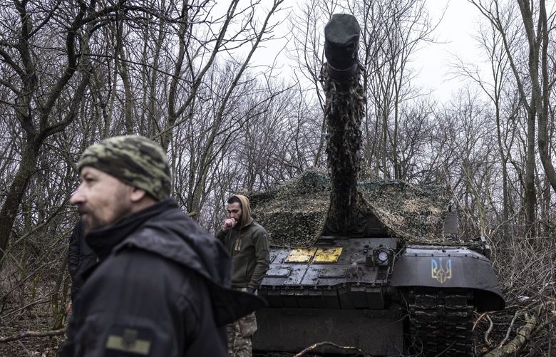 Ukrainian military mechanics work on a Soviet-era T-72 tank captured from the Russians in the Donetsk region of eastern Ukraine on March 19. MUST CREDIT: Photo for The Washington Post by Heidi Levine