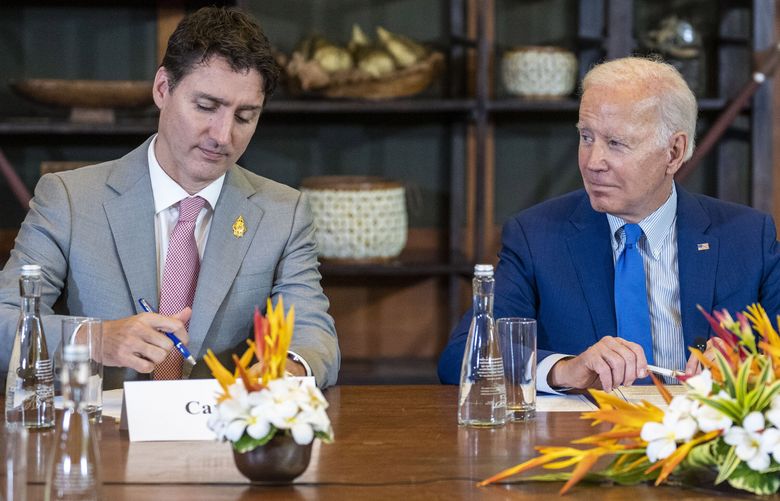 FILE- President Joe Biden looks to Canadian Prime Minister Justin Trudeau during a meeting of G7 and NATO leaders in Bali, Indonesia, Nov. 16, 2022. Biden arrives in Canada on Thursday, March 23, 2023, with a focus on several of the world’s largest challenges: the war in Ukraine, climate change, trade, mass migration and an increasingly assertive China. The administration has made strengthening its friendship with Canada a priority over the past two years. Biden’s meetings with Trudeau in the capital of Ottawa is an opportunity to set plans for the future. (Doug Mills/The New York Times via AP, Pool, File) NYNYT101 NYNYT101 (Doug Mills / The Associated Press)