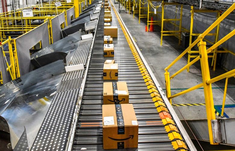 Packages move along a conveyor belt at an Amazon Fulfillment center on Cyber Monday in Robbinsville, New Jersey, US, on Monday, Nov. 28, 2022. US retailers showed modest sales growth over Black Friday weekend, using deep discounts to lure shoppers stung by the rising cost of living. Cyber Monday results will paint a fuller picture of demand this holiday season, analysts say. Photographer: Stephanie Keith/Bloomberg 775905924